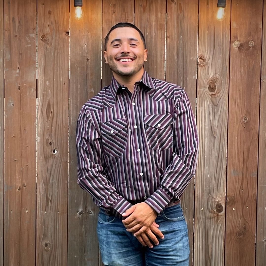 Men's long-sleeve stripe western shirt. Western shirt has burgundy, black and white stripes with pearl snap buttons.