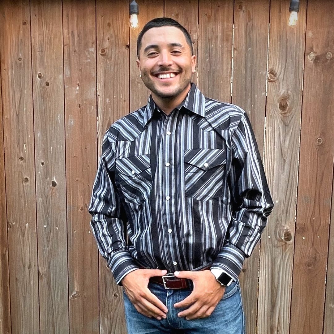 Men's long-sleeve stripe western shirt. Western shirt has black and grey stripes with pearl snap buttons.