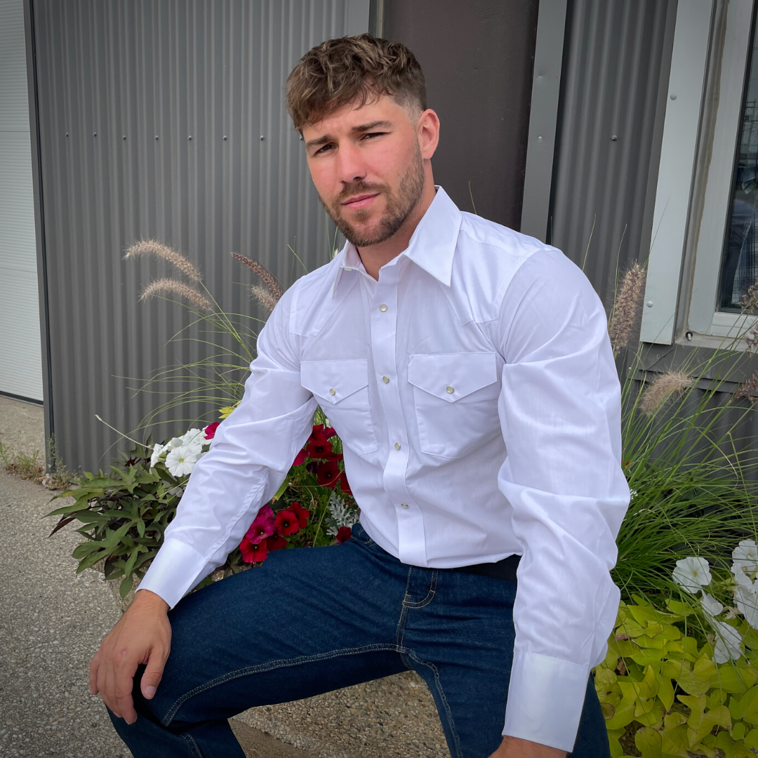 Men's long-sleeve western shirt. Western is white with two front pockets and pearl snap buttons.