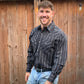 Men's long-sleeve stripe western shirt. Western shirt is black with white stripes and pearl snap buttons.