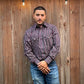 Men's long-sleeve stripe western shirt. Western shirt has burgundy, black and white stripes with pearl snap buttons.