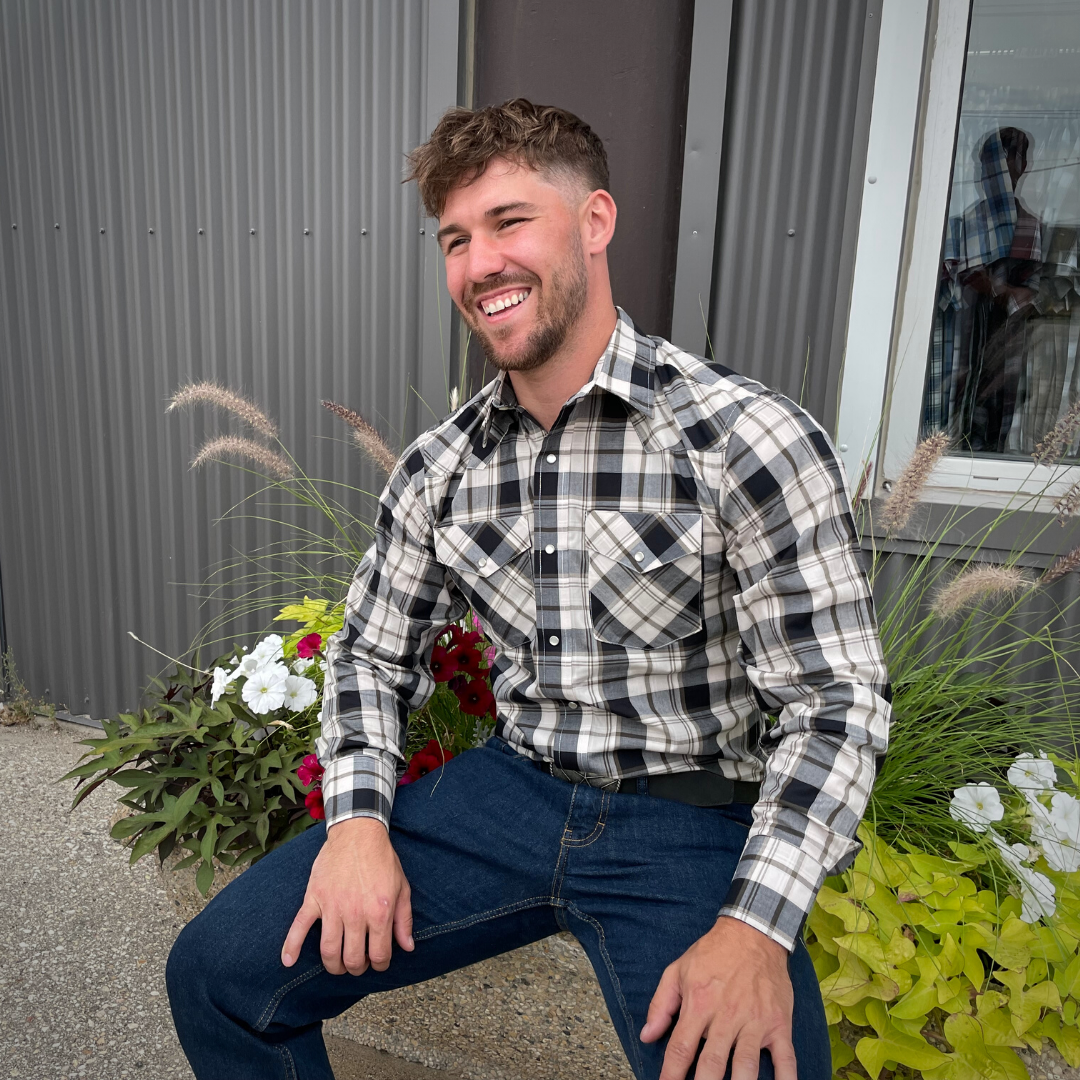 Men's long-sleeve plaid western shirt. Western shirt is white, black and gold with pearl snaps.