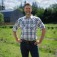 Men's short-sleeve plaid western shirt. Western shirt is white & blue with pearl snaps.